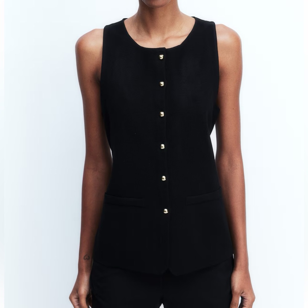 Black sleeveless button-up vest top